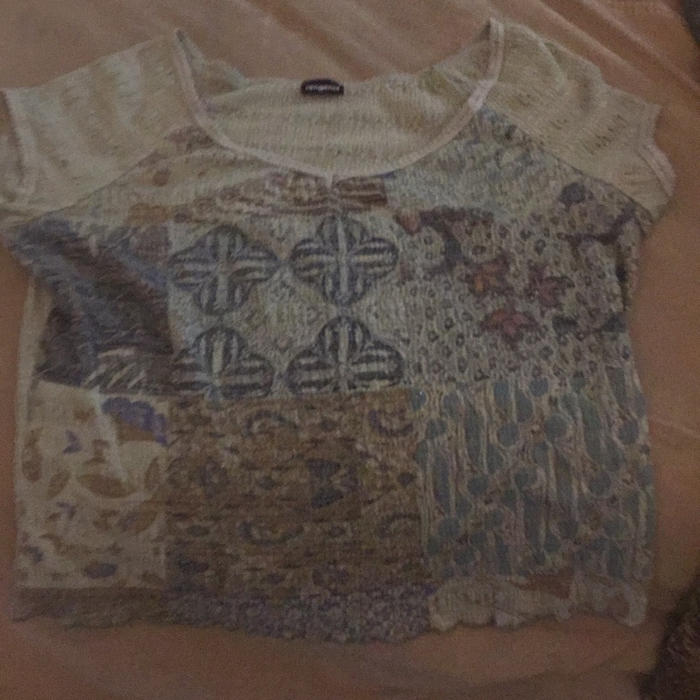 Short sleeve  has some sparkle things on front